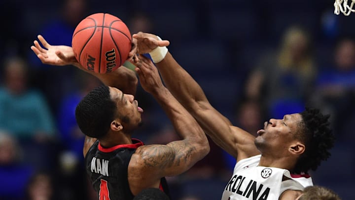 Mar 11, 2016; Nashville, TN, USA; South Carolina Gamecocks forward Chris Silva (30) blocks a shot attempt by Georgia Bulldogs guard Charles Mann (2) in the first half during the SEC tournament at Bridgestone Arena. Mandatory Credit: Christopher Hanewinckel-Imagn Images