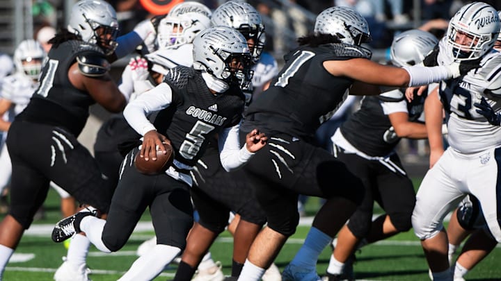 Harrisburg quarterback Jaiyon Lewis (5) runs with the ball after picking up his own fumble in the first half of a District 3 Class 6A quarterfinal game against Dallastown, Saturday, Nov. 9, 2024, at Severance Field in Harrisburg.