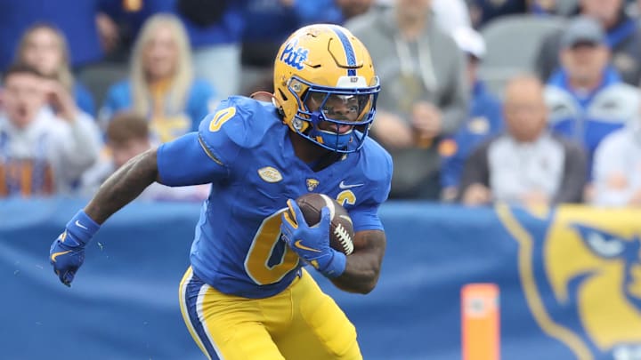 Nov 15, 2025; Pittsburgh, Pennsylvania, USA;  Pittsburgh Panthers running back Desmond Reid (0) runs after catch against the Notre Dame Fighting Irish during the first quarter at Acrisure Stadium. Mandatory Credit: Charles LeClaire-Imagn Images