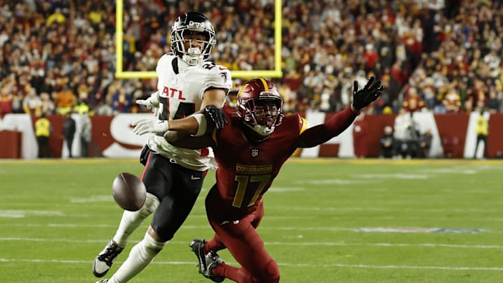 Dec 29, 2024; Landover, Maryland, USA; Washington Commanders wide receiver Terry McLaurin (17) attempts to catch a pass as Atlanta Falcons cornerback A.J. Terrell (24) defends during the third quarter at Northwest Stadium. Mandatory Credit: Geoff Burke-Imagn Images