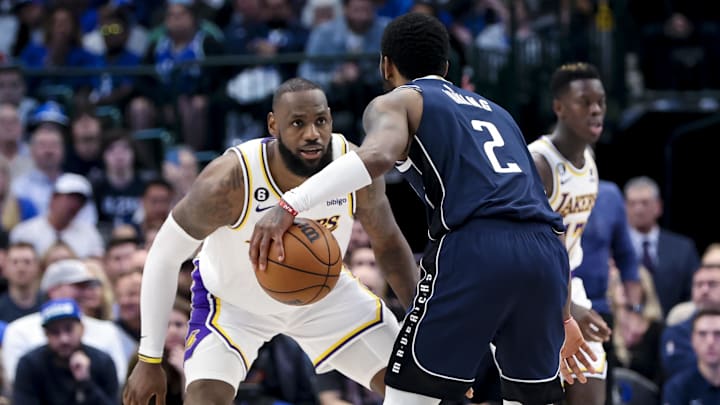 Feb 26, 2023; Dallas, Texas, USA; Los Angeles Lakers forward LeBron James (6) guards Dallas Mavericks guard Kyrie Irving (2) during the fourth quarter at American Airlines Center. Mandatory Credit: Kevin Jairaj-Imagn Images