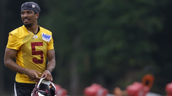 Jun 5, 2024; Ashburn, VA, USA; Washington Commanders quarterback Jayden Daniels (5) stands on the field during OTA workouts at Commanders Park. Jun 5, 2024; Ashburn, VA, USA; Washington Commanders quarterback Jayden Daniels (5) stands on the field during OTA workouts at Commanders Park.
