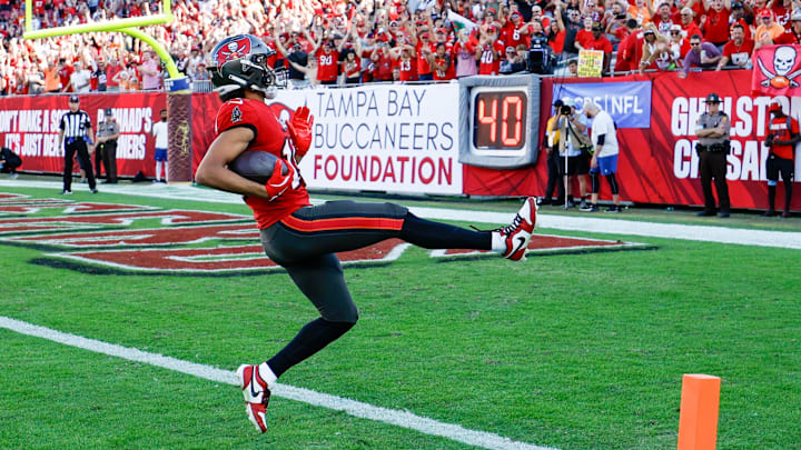 Tampa Bay Bucs receiver Jalen McMillan, the former Husky, high-steps into the end zone with one of his two scores against Las Vegas. Tampa Bay Bucs receiver Jalen McMillan, the former Husky, high-steps into the end zone with one of his two scores against Las Vegas.