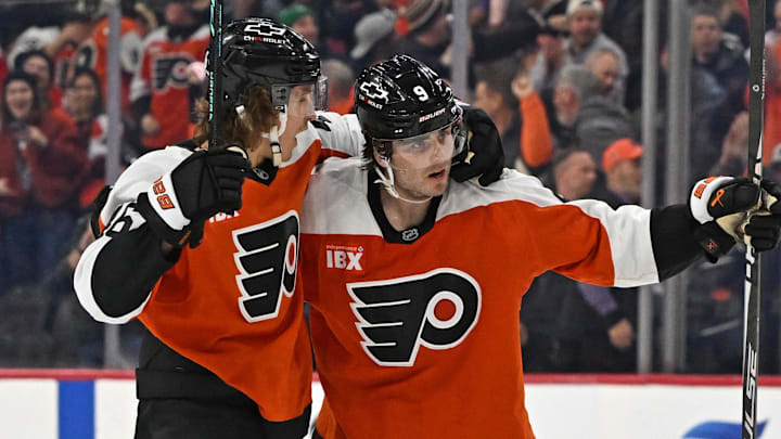 Feb 3, 2026; Philadelphia, Pennsylvania, USA; Philadelphia Flyers defenseman Jamie Drysdale (9) celebrates his goal with center Trevor Zegras (46) against the Washington Capitals during the third period at Xfinity Mobile Arena. Mandatory Credit: Eric Hartline-Imagn Images
