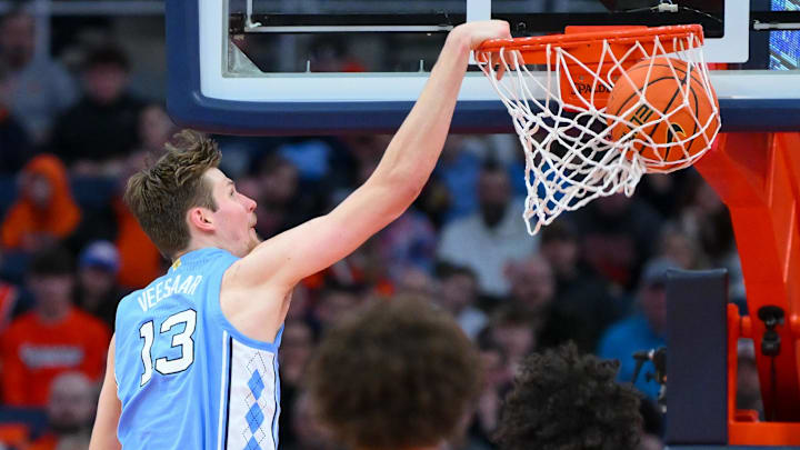 Feb 21, 2026; Syracuse, New York, USA; North Carolina Tar Heels center Henri Veesaar (13) dunks during the second half against the Syracuse Orange at the JMA Wireless Dome. Mandatory Credit: Rich Barnes-Imagn Images