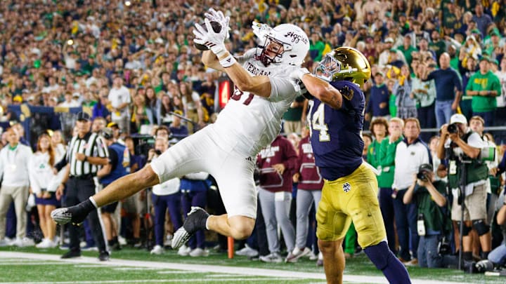 Texas A&M tight end Nate Boerkircher, left, catches a pass in the end zone to tie the game with Notre Dame linebacker Drayk Bowen, right, defending in the second half of a NCAA football game at Notre Dame Stadium on Saturday, Sept. 13, 2025, in South Bend. The extra point scored after this touchdown put Texas A&M ahead 41-40 to win the game. Texas A&M tight end Nate Boerkircher, left, catches a pass in the end zone to tie the game with Notre Dame linebacker Drayk Bowen, right, defending in the second half of a NCAA football game at Notre Dame Stadium on Saturday, Sept. 13, 2025, in South Bend. The extra point scored after this touchdown put Texas A&M ahead 41-40 to win the game.