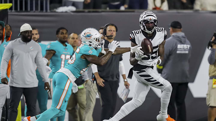 Cincinnati Bengals wide receiver Tee Higgins (85) catches a pass against Miami Dolphins cornerback Xavien Howard (25) in the first half at Paycor Stadium in a 2022 game.
