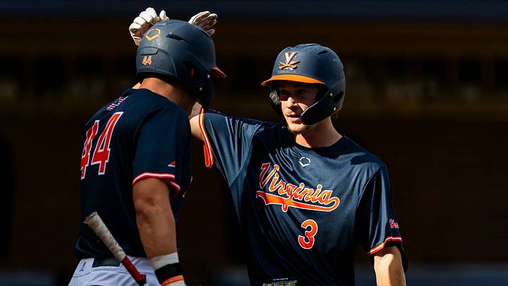 Virginia Cavaliers Antonio Perrotta (44) and Reid Howard (3) celebrate at home plate. 