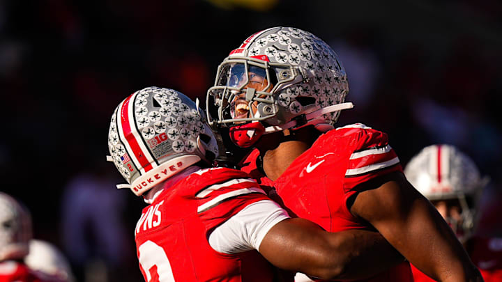 Ohio State Buckeyes defensive back Caleb Downs (2) celebrates with linebacker Sonny Styles (0) after sacking Rutgers Scarlet Knights quarterback Athan Kaliakmanis (16) in the second half of the NCAA football game at Ohio Stadium on Saturday, Nov. 22, 2025 in Columbus, Ohio.