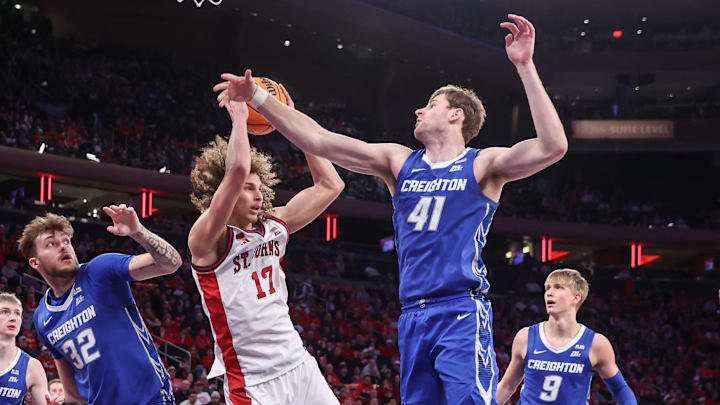 St. John's Red Storm forward Rubén Prey (17) and Creighton Bluejays forward Isaac Traudt (41) fight for a loose ball in the second half at Madison Square Garden.