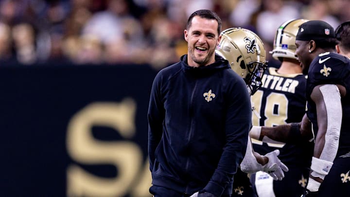 Dec 15, 2024; New Orleans, Louisiana, USA;  New Orleans Saints quarterback Derek Carr (4) after a touchdown against the Washington Commanders during the second half at Caesars Superdome. Mandatory Credit: Stephen Lew-Imagn Images