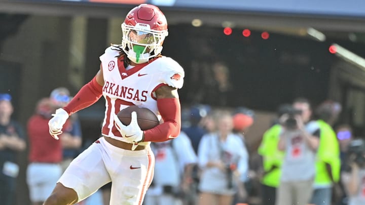 Arkansas Razorbacks defensive back TJ Metcalf returns an interception against the Auburn Tigers at Jordan-Hare Stadium in Auburn, Ala.