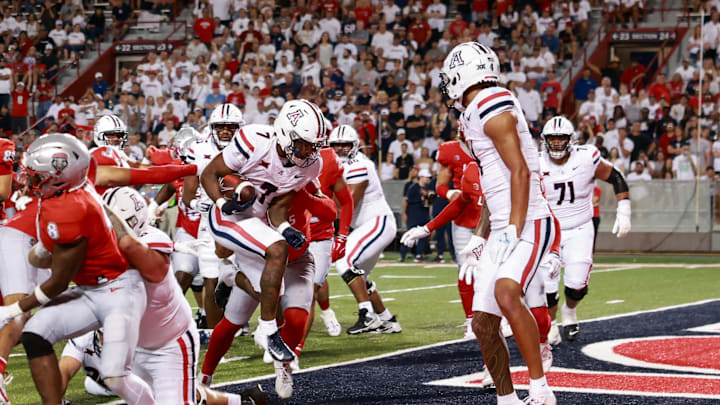 Aug 31, 2024; Tucson, Arizona, USA; Arizona Wildcats running back Quail Conley (7) runs a touchdown during third quarter at Arizona Stadium. Mandatory Credit: Aryanna Frank-Imagn Images
