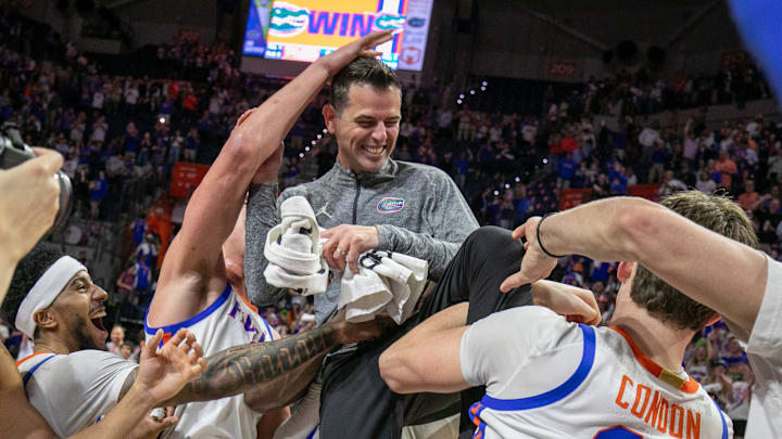 Florida celebrate Florida head coach Todd Golden’s 100th win and beating Mississippi State 108-77 after an NCAA mens basketball game at Steven C. O'Connell Center Exactek arena in Gainesville, FL on Tuesday, March 3, 2026. [Alan Youngblood/Gainesville Sun]