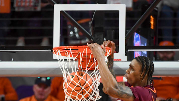 Feb. 11, 2026; Virginia Tech forward Tobi Lawal (1) dunks the ball.