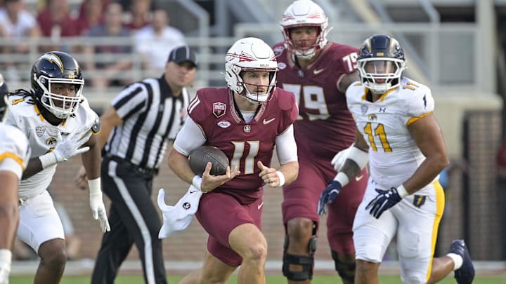 Sep 20, 2025; Tallahassee, Florida, USA; Florida State Seminoles quarterback Brock Glenn (11) runs the ball during the second half against the Kent State Golden Flashes at Doak S. Campbell Stadium. Mandatory Credit: Melina Myers-Imagn Images