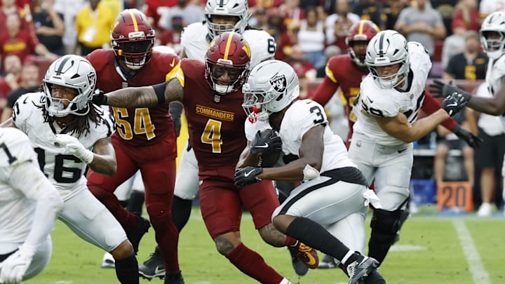 Sep 21, 2025; Landover, Maryland, USA;Las Vegas Raiders running back Zamir White (3) carries the ball as Washington Commanders linebacker Frankie Luvu (4) chases during the third quarter at Northwest Stadium. Mandatory Credit: Geoff Burke-Imagn Images Sep 21, 2025; Landover, Maryland, USA;Las Vegas Raiders running back Zamir White (3) carries the ball as Washington Commanders linebacker Frankie Luvu (4) chases during the third quarter at Northwest Stadium. Mandatory Credit: Geoff Burke-Imagn Images