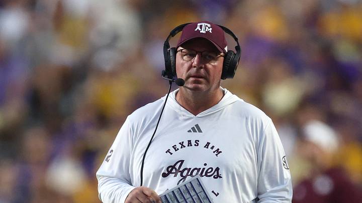 Texas A&M Aggies head coach Mike Elko walks on the field during a time-out during the first quarter against the LSU Tigers xat Tiger Stadium. Texas A&M Aggies head coach Mike Elko walks on the field during a time-out during the first quarter against the LSU Tigers xat Tiger Stadium.