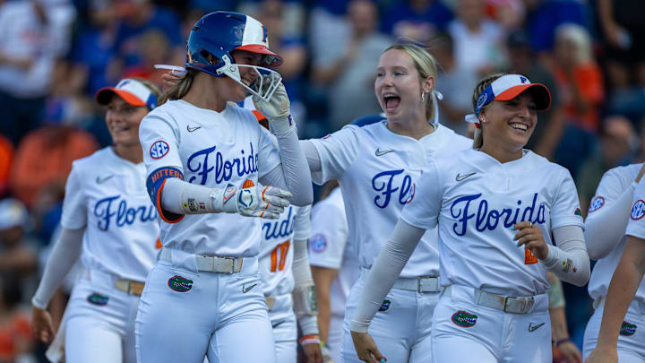 Florida outfielder Taylor Shumaker (21), left, celebrates a home run during an NCAA softball game at Katie Seashole Pressly Stadium in Gainesville, FL on Friday, April 18, 2025. Florida won 12-4 in the fifth inning. [Alan Youngblood/Gainesville Sun