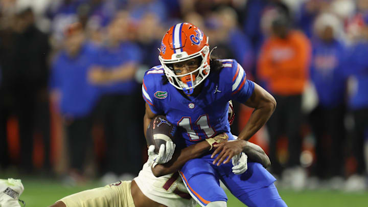Florida wide receiver Aidan Mizell (11) makes yards against Florida State during the second half of an NCAA football game at Steve Spurrier Field at Ben Hill Griffin Stadium in Gainesville, FL on Saturday, November 29, Florida beat Florida State 40-21.2025. [Alan Youngblood/Gainesville Sun]