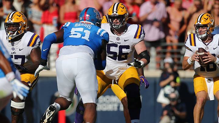 Sep 27, 2025; Oxford, Mississippi, USA; LSU Tigers offensive lineman Josh Thompson (56) blocks Mississippi Rebels defensive lineman Zxavian Harris (51) during the second quarter at Vaught-Hemingway Stadium. Mandatory Credit: Petre Thomas-Imagn Images Sep 27, 2025; Oxford, Mississippi, USA; LSU Tigers offensive lineman Josh Thompson (56) blocks Mississippi Rebels defensive lineman Zxavian Harris (51) during the second quarter at Vaught-Hemingway Stadium. Mandatory Credit: Petre Thomas-Imagn Images