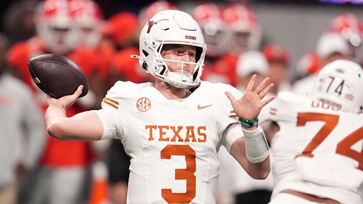 Dec 7, 2024; Atlanta, GA, USA; Texas Longhorns quarterback Quinn Ewers (3) drops back to pass against the Georgia Bulldogs during the first half in the 2024 SEC Championship game at Mercedes-Benz Stadium. Mandatory Credit: Dale Zanine-Imagn Images