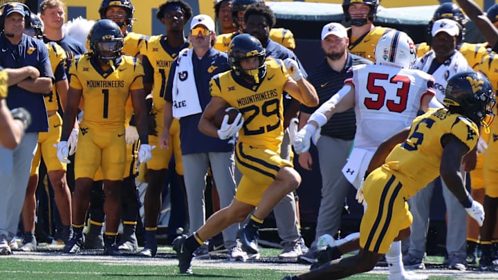 West Virginia University receiver Preston Fox returns a punt against Robert Morris. West Virginia University receiver Preston Fox returns a punt against Robert Morris.