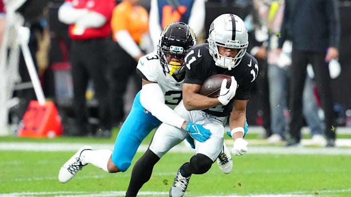 Las Vegas Raiders wide receiver Tre Tucker (11) is tackled by Jacksonville Jaguars cornerback Tyson Campbell (3) during the second quarter at Allegiant Stadium. Las Vegas Raiders wide receiver Tre Tucker (11) is tackled by Jacksonville Jaguars cornerback Tyson Campbell (3) during the second quarter at Allegiant Stadium.
