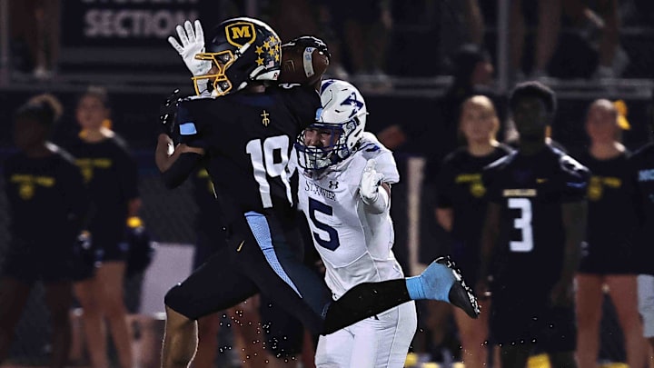 Moeller wide receiver catches a pass in front of St. Xavier during their football game Friday, Sept. 19, 2025.