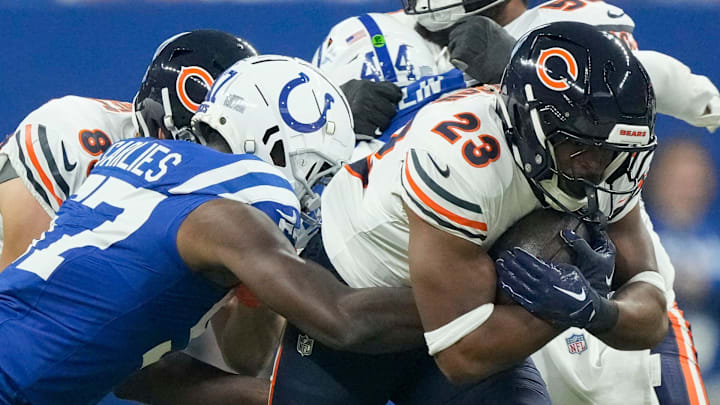 Indianapolis Colts linebacker Jaylon Carlies (57) tackles Chicago Bears running back Roschon Johnson (23) on Sunday, Sept. 22, 2024, during a game against the Chicago Bears at Lucas Oil Stadium in Indianapolis.