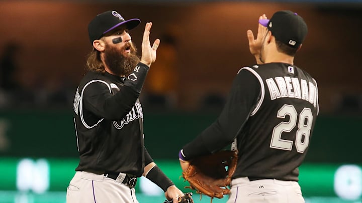 May 21, 2019; Pittsburgh, PA, USA;  Colorado Rockies right fielder Charlie Blackmon (19) and third baseman Nolan Arenado (28) celebrate after defeating the Pittsburgh Pirates at PNC Park. The Rockies shutout the Pirates 4-0.
