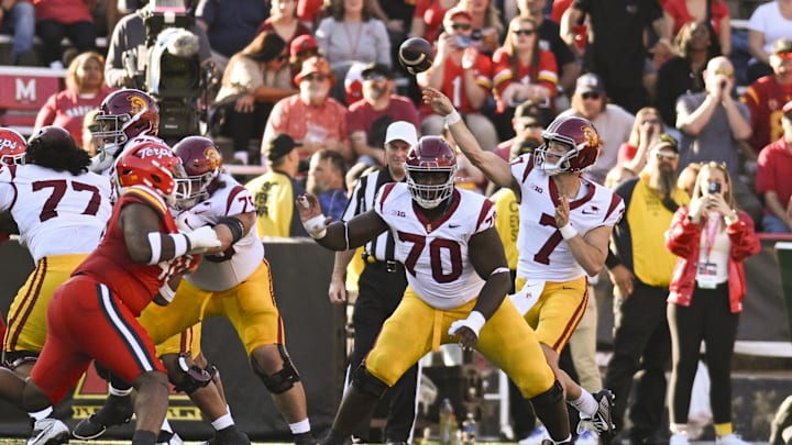 Oct 19, 2024; College Park, Maryland, USA;  Southern California Trojans quarterback Miller Moss (7) throws during the first half against the Maryland Terrapins at SECU Stadium. Mandatory Credit: Tommy Gilligan-Imagn Images