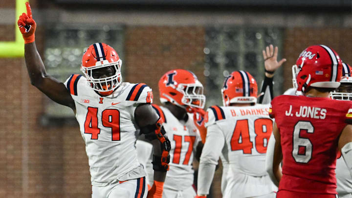 Oct 14, 2023; College Park, Maryland, USA;  Illinois Fighting Illini linebacker Seth Coleman (49) reacts afrer Maryland Terrapins quarterback Taulia Tagovailoa (3) is sacked in the third quarterat SECU Stadium. Mandatory Credit: Tommy Gilligan-Imagn Images