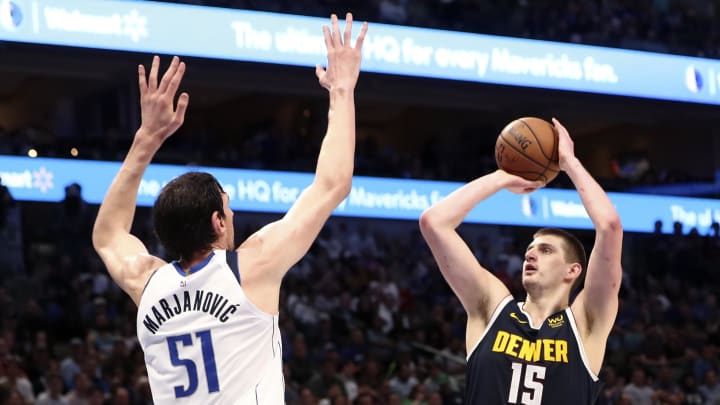 Mar 11, 2020; Dallas, Texas, USA;  Denver Nuggets center Nikola Jokic (15) shoots over Dallas Mavericks center Boban Marjanovic (51) during the second half at American Airlines Center. Mandatory Credit: Kevin Jairaj-USA TODAY Sports