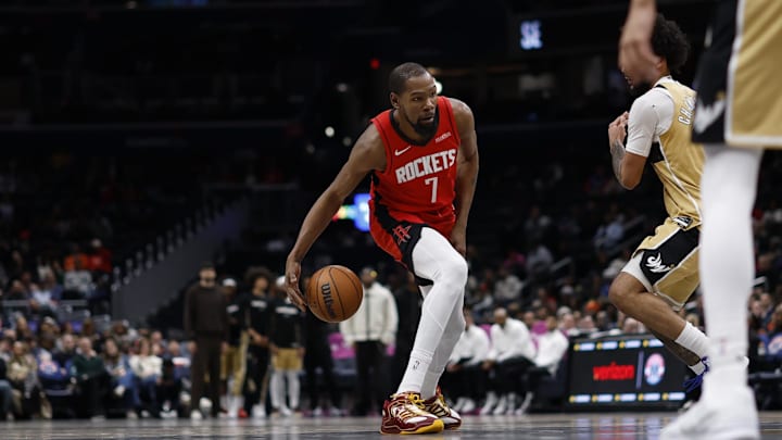 Mar 2, 2026; Washington, District of Columbia, USA; Houston Rockets forward Kevin Durant (7) dribbles the ball as Washington Wizards forward Justin Champagnie (9) defends in the second half at Capital One Arena. Mandatory Credit: Geoff Burke-Imagn Images