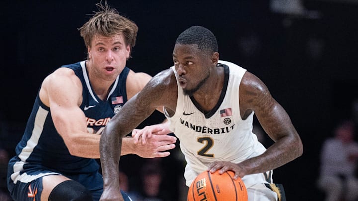 Vanderbilt guard Duke Miles (2) drives on Virginia guard Dallin Hall (30) during the second half of their exhibition game at Memorial Gym in Nashville, Tenn., Thursday, Oct. 16, 2025.