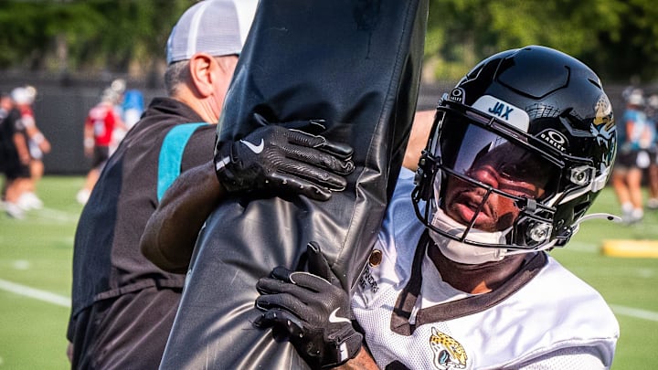 Jacksonville Jaguars cornerback Aydan White (40) wraps up a tackling dummy during the seventh organized team activity at the Miller Electric Center in Jacksonville, Fla. Monday, June 2, 2025.