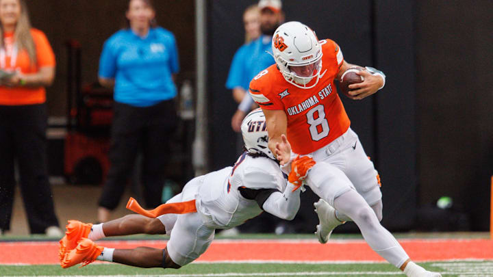 Aug 28, 2025; Stillwater, Oklahoma, USA; Oklahoma State Cowboys quarterback Hauss Hejny (8) runs the ball during the first half against the Tennessee Martin Skyhawks  at Boone Pickens Stadium. Mandatory Credit: William Purnell-Imagn Images