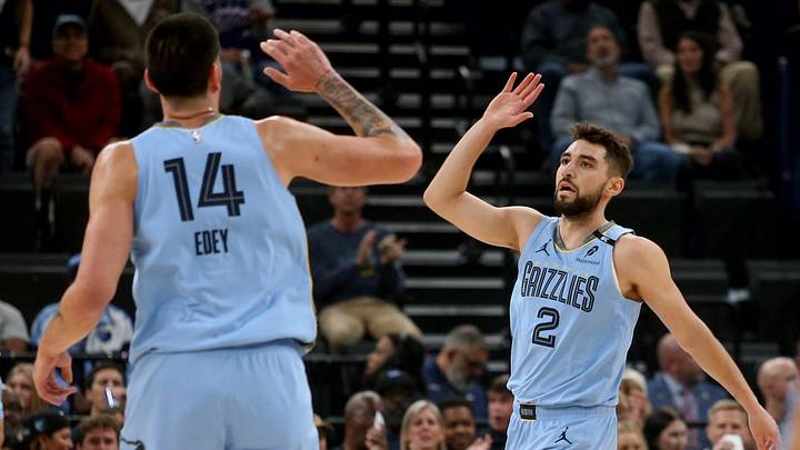 Oct 21, 2026; Memphis, Tennessee, USA; Memphis Grizzlies guard Ty Jerome (2) reacts with center Zach Edey (14) during the first quarter against the Utah Jazz at FedExForum. Mandatory Credit: Petre Thomas-Imagn Images Oct 21, 2026; Memphis, Tennessee, USA; Memphis Grizzlies guard Ty Jerome (2) reacts with center Zach Edey (14) during the first quarter against the Utah Jazz at FedExForum. Mandatory Credit: Petre Thomas-Imagn Images