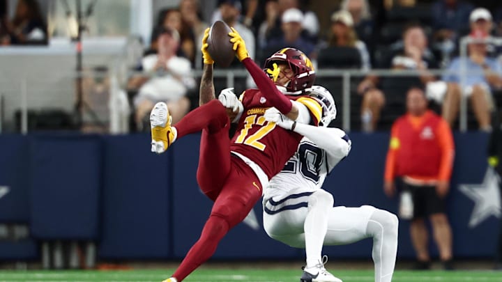 Washington Commanders wide receiver Robbie Chosen (12) makes a reception defended by Dallas Cowboys cornerback Kaiir Elam (20) 