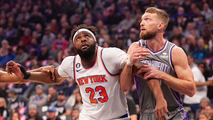 Mar 9, 2023; Sacramento, California, USA; New York Knicks center Mitchell Robinson (23) and Sacramento Kings forward Domantas Sabonis (10) fight for position under the basket during the first quarter at Golden 1 Center. Mar 9, 2023; Sacramento, California, USA; New York Knicks center Mitchell Robinson (23) and Sacramento Kings forward Domantas Sabonis (10) fight for position under the basket during the first quarter at Golden 1 Center.