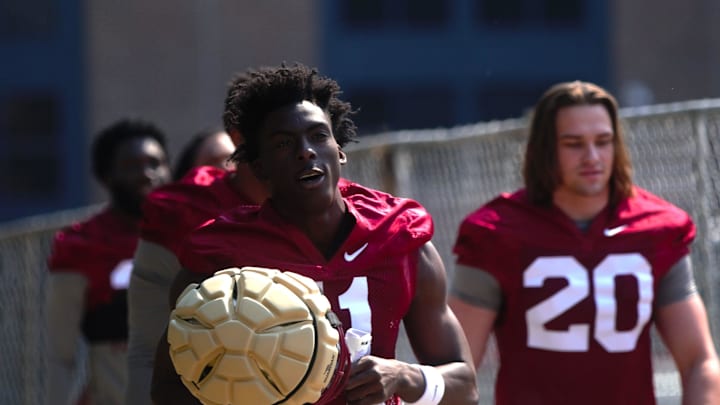 FSU football players walk into the first spring practice of the spring season on Wednesday, March 19, 2025