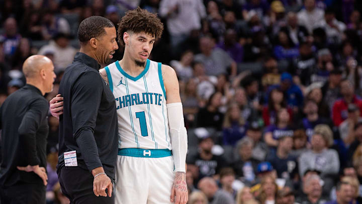Feb 24, 2025; Sacramento, California, USA; Charlotte Hornets head coach Charles Lee talks with guard LaMelo Ball (1) during a time out in the fourth quarter of the game against the Sacramento Kings at Golden 1 Center. Mandatory Credit: Ed Szczepanski-Imagn Images