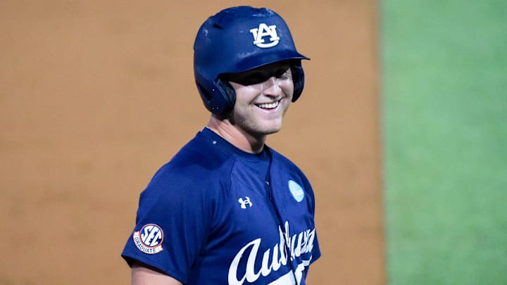Auburn Tigers' Ike Irish (18) jokes with the dugout