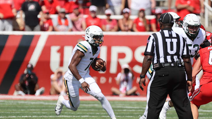 Sep 7, 2024; Salt Lake City, Utah, USA; Baylor Bears quarterback Dequan Finn (7) runs the ball against the Utah Utes during the second quarter at Rice-Eccles Stadium. Mandatory Credit: Rob Gray-Imagn Images