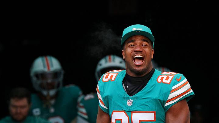 Dec 21, 2025; Miami Gardens, Florida, USA; Miami Dolphins linebacker Tyrel Dodson (25) runs on the field at the start of the game against the Cincinnati Bengals at Hard Rock Stadium. Mandatory Credit: Nathan Ray Seebeck-Imagn Images