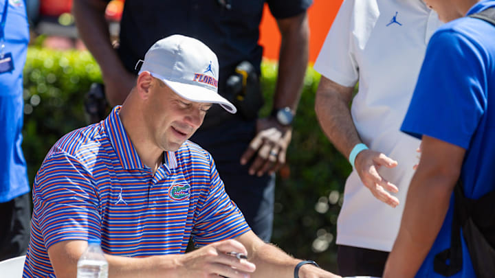 Florida head coach Jon Sumrall autographs items during the second half of the Orange and Blue game at Steve Spurrier Field at Ben Hill Griffin Stadium in Gainesville, FL on Saturday, April 11, 2026. [Alan Youngblood/Gainesville Sun]