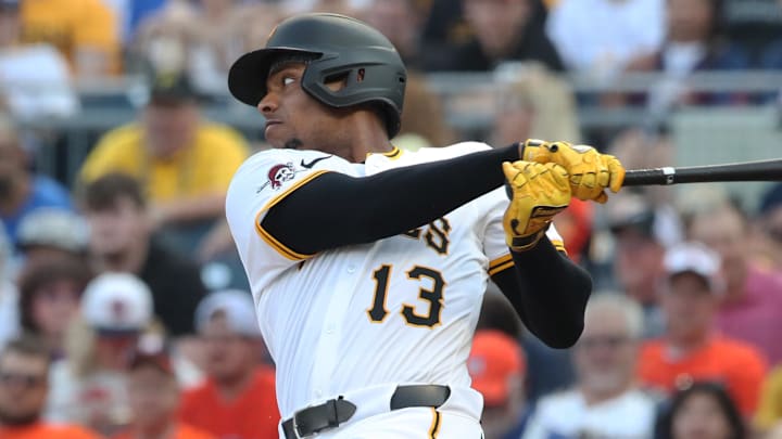 Jun 4, 2025; Pittsburgh, Pennsylvania, USA;  Pittsburgh Pirates third baseman Ke'Bryan Hayes (13) hits a single against the Houston Astros during the third inning at PNC Park. Mandatory Credit: Charles LeClaire-Imagn Images