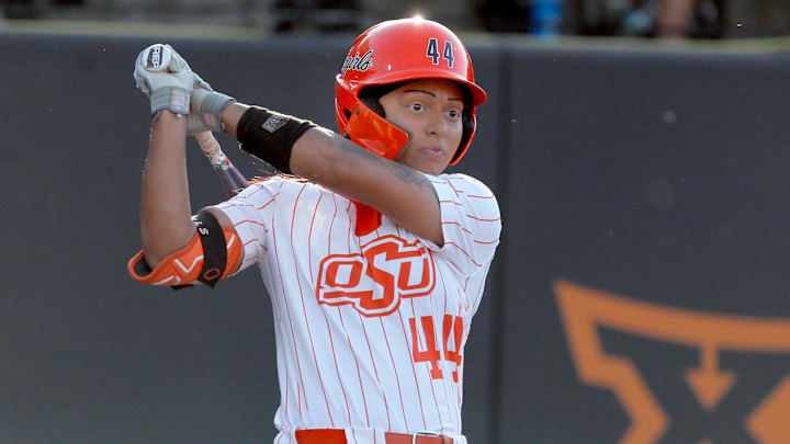 Oklahoma State's Tallen Edwards (44) hits a double in the first inning during the NCAA softball tournament Stillwater Super Regional game between the Oklahoma State Cowgirls and the Arizona Wildcats in Stillwater, Okla., Friday, May, 24, 2024.