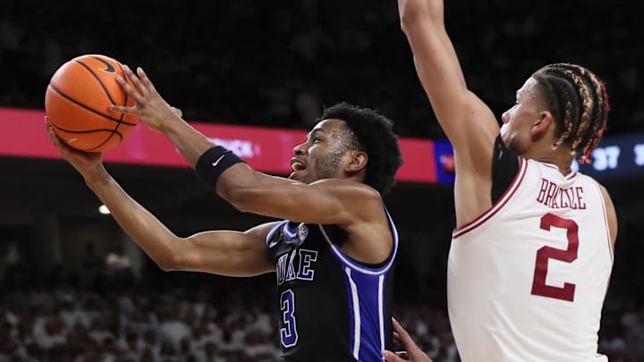Nov 29, 2023; Fayetteville, Arkansas, USA; Duke Blue Devils guard Jeremy Roach (3) drives to the during the first half as Arkansas Razorbacks forward Trevon Brazile (2) defends at Bud Walton Arena. Arkansas won 80-75. Mandatory Credit: Nelson Chenault-USA TODAY Sports